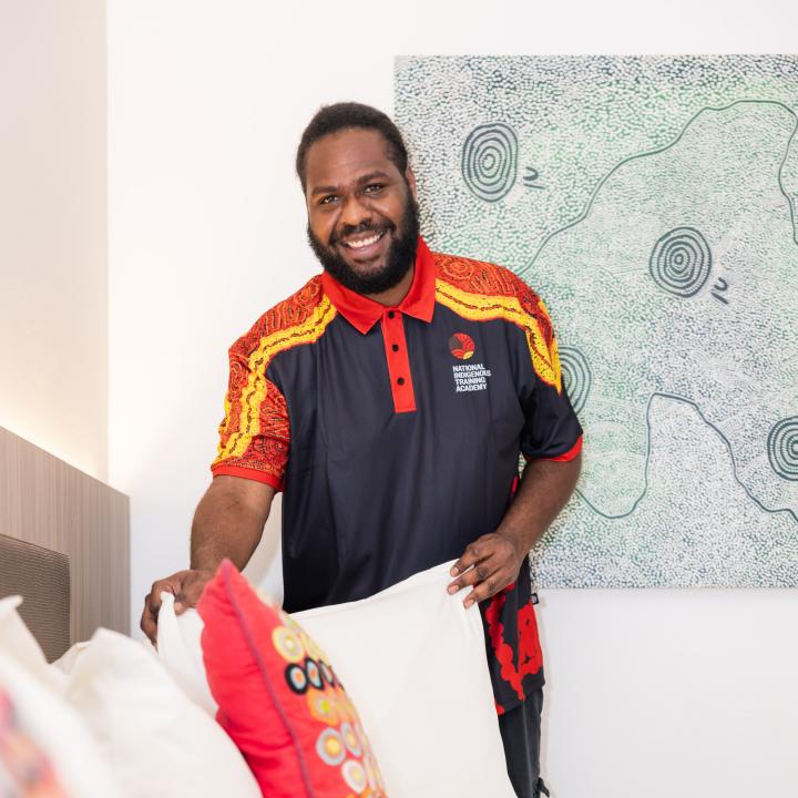 A housekeeping trainee with the National Indigenous Training Academy (NITA)